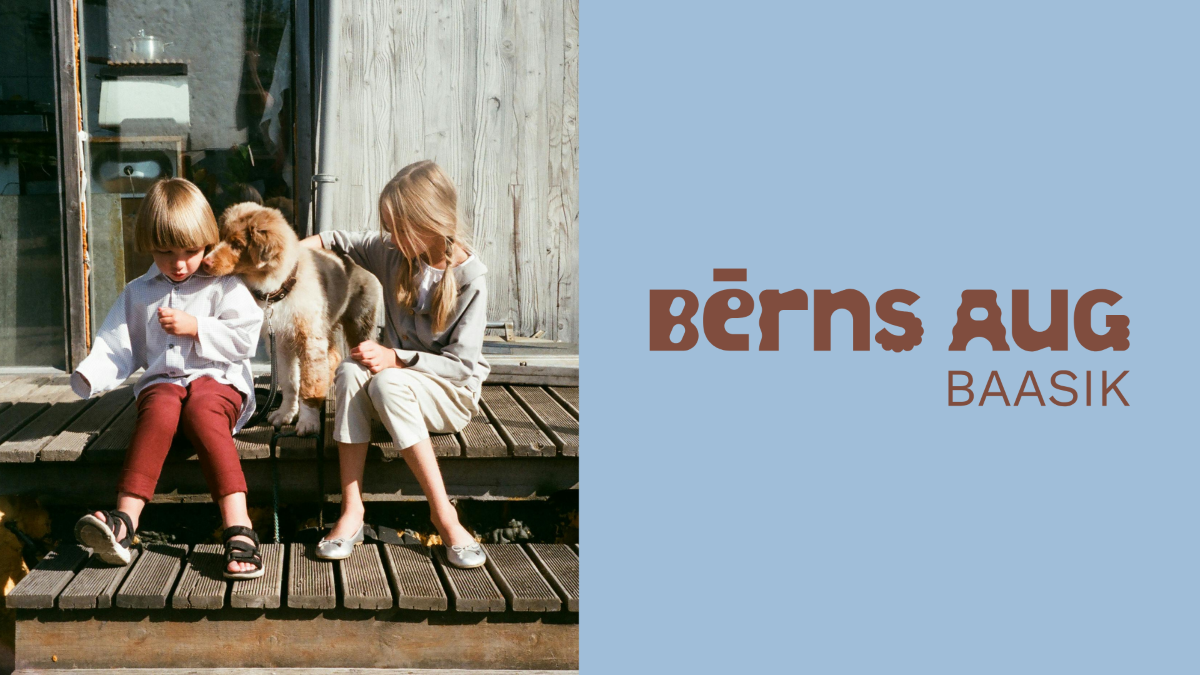Divi bērni kopā ar suni uz projekta “Bērns aug” BAASIK vizuāļa.